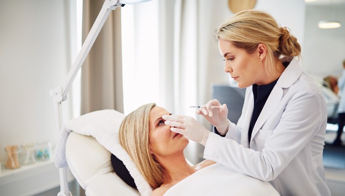 Woman prepares to get botox on the face.